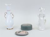 two vases and a small bowl on the table