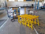 a large room that has a bunch of yellow barricades on the floor