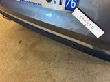a sticker on the back of a car that has a sticker on it