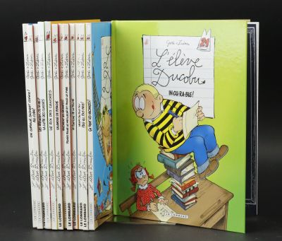 a book that has a picture of a boy on a desk