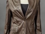 a brown leather jacket on a mannequin mannequin mannequin mannequin mannequin mannequin mannequin mannequin manne