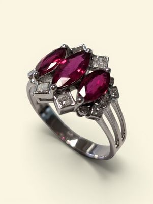 an image of a close up of a ring with two ruby stones