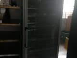 an image of a refrigerator in a kitchen with a lot of shelves