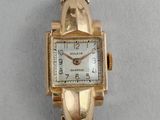 an image of a ladies ' s watch with a gold bracelet