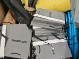 a cardboard box full of electronics and other items