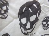 a black and white image of skulls on a white shirt