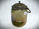 a glass jar with a lid on a white surface