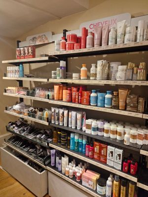 many different types of cosmetics on the shelves in the store