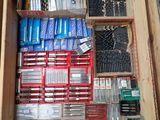 a wooden box filled with assorted tools in it