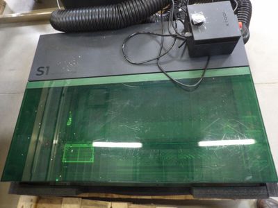 an image of a green glass table top with a blow dryer on it