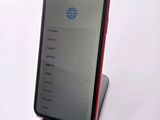 a cell phone that is sitting on top of a stand