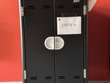 two black lockers sitting next to each other in a room