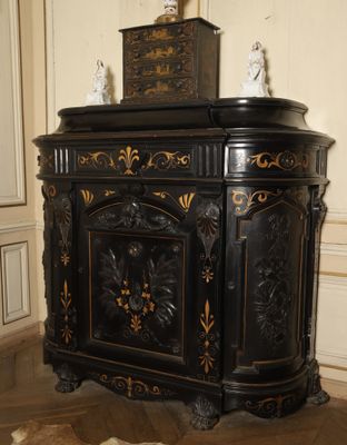 a black cabinet with a clock on top of it