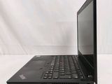 laptop computer sitting on a white surface with a white background