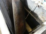 a metal radiator in the middle of a dirty sink