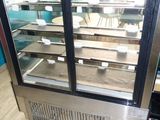 an image of a refrigerated display case in a kitchen