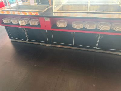 a picture of a counter with plates and bowls on it