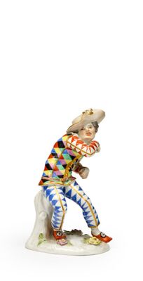 une image représentant une figurine d'un homme tenant une batte de baseball
