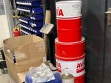 a stack of barrels sitting on a pallet in a warehouse