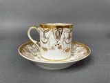 an image of a cup and saucer on a saucer on a table