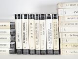 a lot of books that are on a shelf