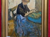 un tableau représentant une femme assise à une table