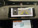 a tablet on the dashboard of a car with a view of the road