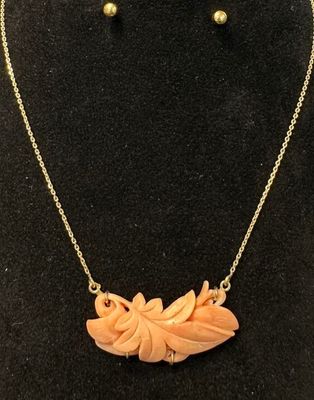 a necklace and earring set made of coral coral coral coral coral coral coral coral coral coral coral coral coral