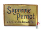 gold plated sign with the words supreme pernot on it