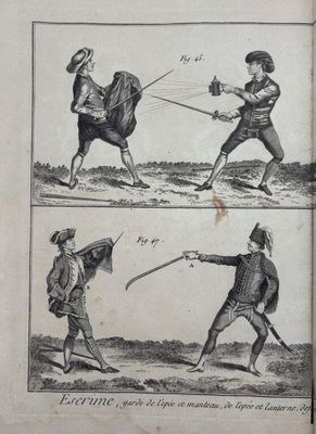 an old book with a picture of two men fighting with swords