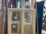 a large window in the middle of a building being built