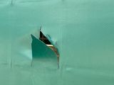 a small boat in the middle of a large body of water