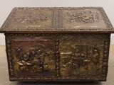 a large metal box that has a lot of carvings on it