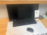 a laptop computer sitting on top of a wooden desk