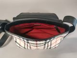 black and white checkered purse with red lining