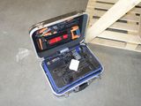 a tool case with tools inside of it on the floor