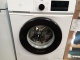 a washing machine sitting on a pallet in a store