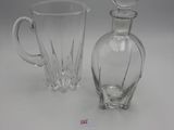 pair of glass decanters and a decanter on a table