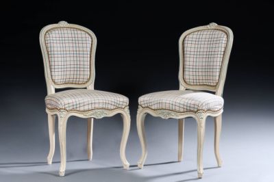 pair of chairs with upholstered back and upholstered seat