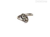an image of a silver ring with a diamond in the middle