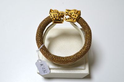 bracelet à imprimé léopard avec un nœud doré