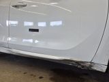 a picture of a car with a denting on the side of it