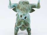 a statue of a bull on a white background