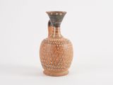 a brown vase with a black top on a white background