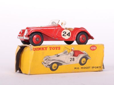a red toy car sitting on top of a yellow box