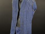 an image of a mannequin dressed in blue jeans and a vest
