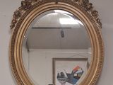 a mirror hanging on the wall in a room