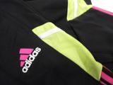 the adidas jacket is black and pink with a white stripe