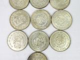 a close up of a bunch of coins sitting on top of a white surface