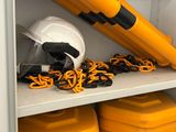 a yellow and black object on a shelf in a cabinet